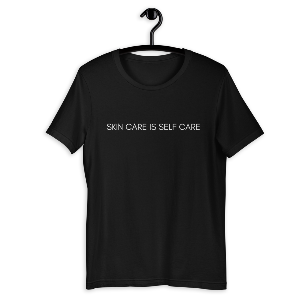 Black shirt from Soft Shop with white text centered in front Skin care is self care